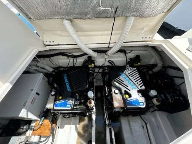 Slide: The Image of Engine compartment of a 2008 Rinker 400 Express Cruiser with twin engines. - 48