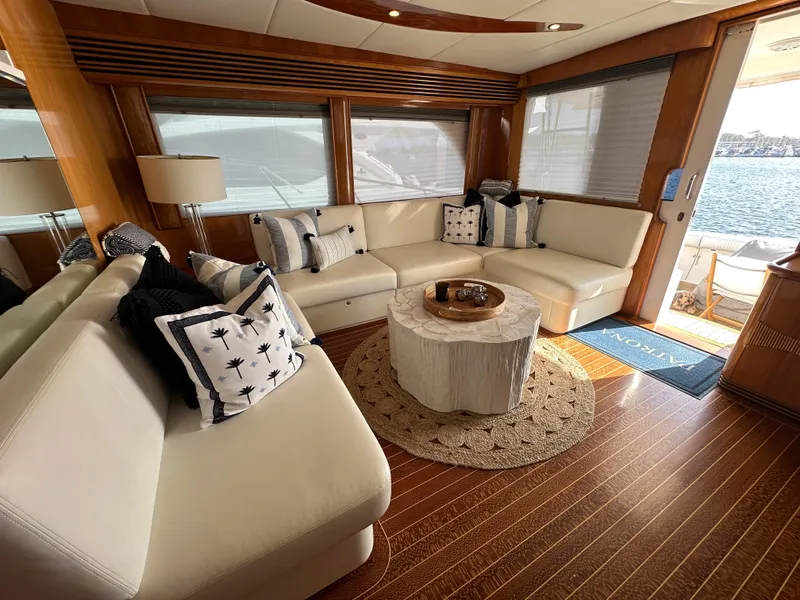 Slide: The Image of Luxurious interior of a 2000 Mikelson 61 Sportfisher yacht with elegant seating and decor. - 12