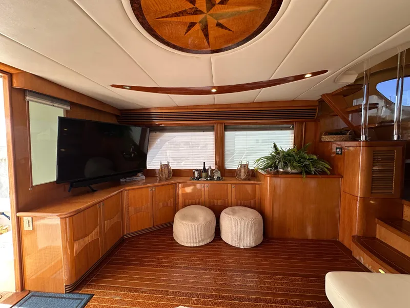 Slide: The Image of Luxurious interior of 2000 Mikelson 61 Sportfisher yacht with wood paneling and modern amenities. - 13