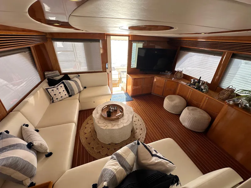 Slide: The Image of Luxurious interior of 2000 Mikelson 61 Sportfisher yacht with elegant seating and decor. - 17
