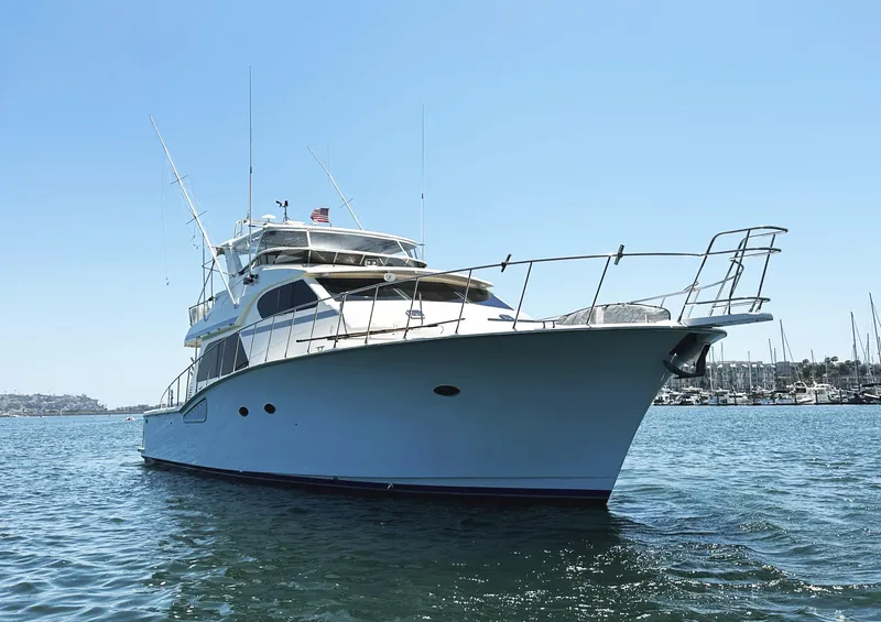 Slide: The Image of Mikelson 61 Sportfisher 2000 yacht on calm water, clear sky background. - 2