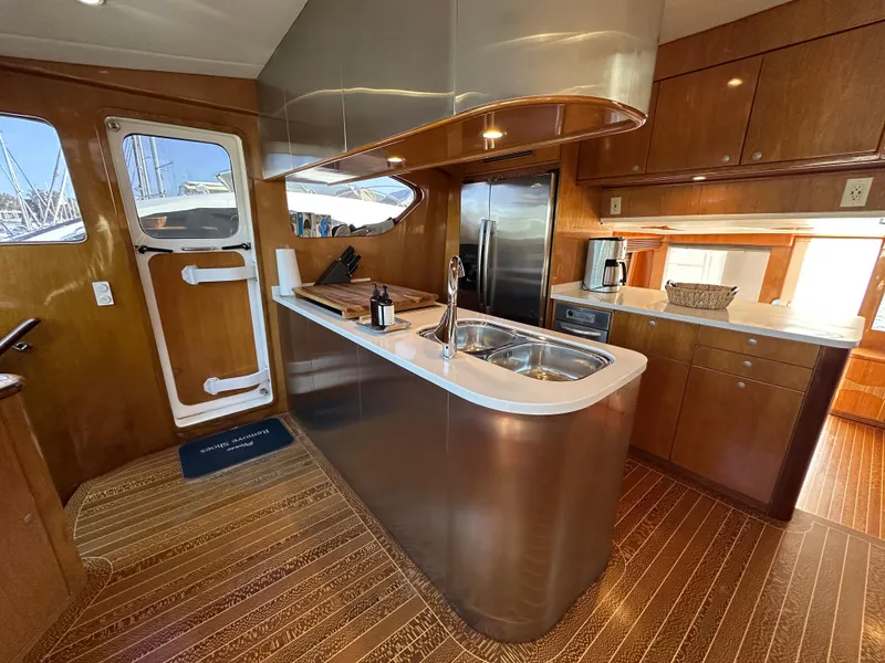 Slide: The Image of Luxurious kitchen interior of 2000 Mikelson 61 Sportfisher yacht with modern amenities. - 20