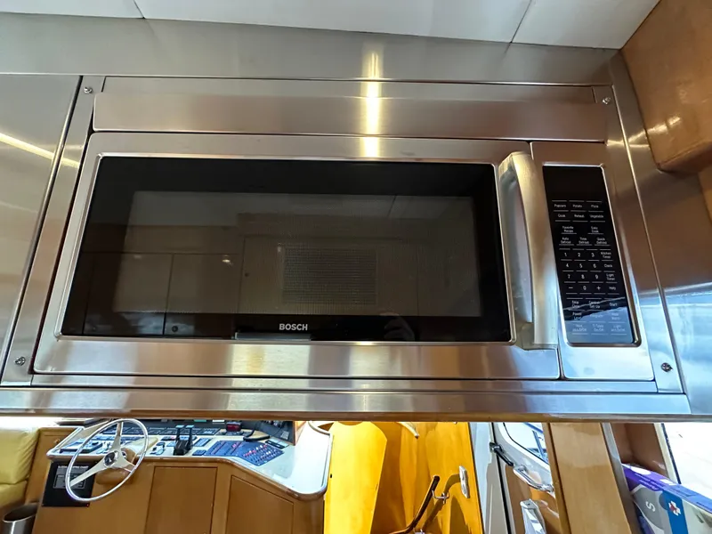 Slide: The Image of Bosch microwave in a 2000 Mikelson 61 Sportfisher yacht kitchen. - 25