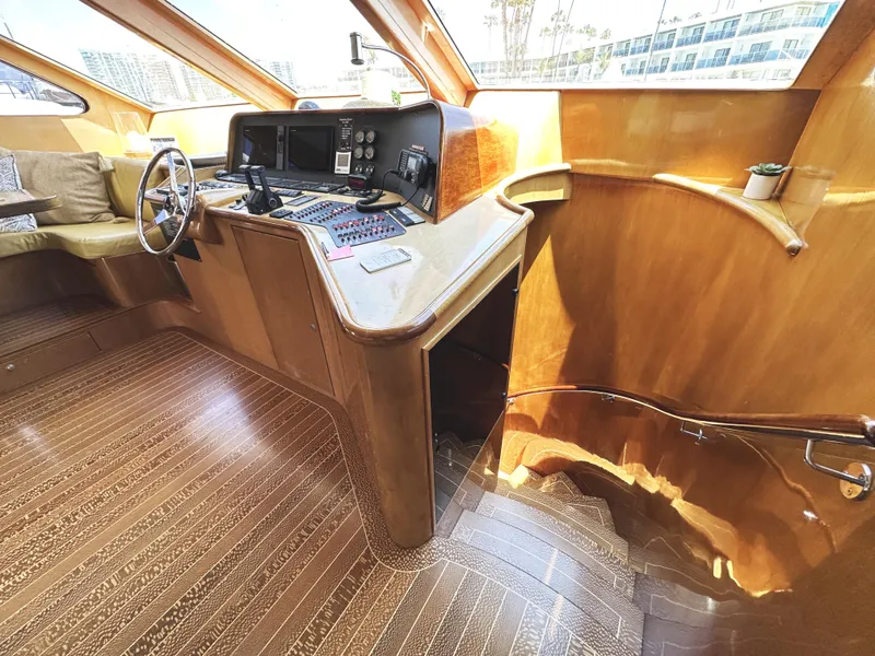 Slide: The Image of Interior of 2000 Mikelson 61 Sportfisher yacht with wooden helm and navigation equipment. - 33