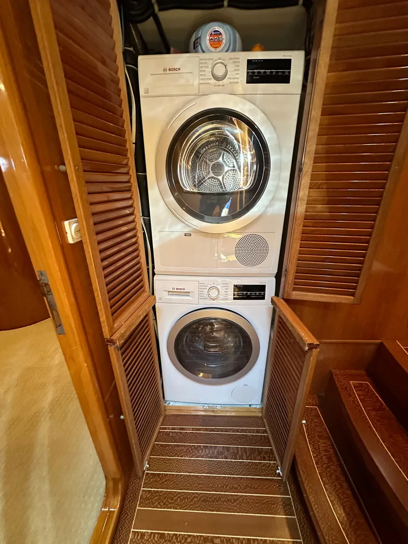 Slide: The Image of Stacked washer and dryer in 2000 Mikelson 61 Sportfisher yacht interior. - 35