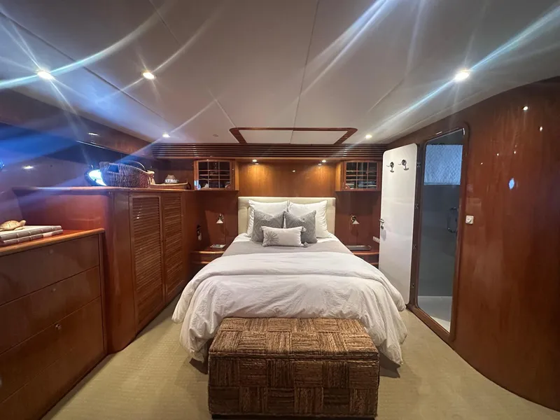 Slide: The Image of Luxurious cabin interior of 2000 Mikelson 61 Sportfisher yacht with elegant wood finishes. - 37