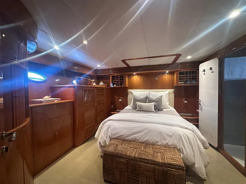 Slide: The Image of Luxurious cabin interior of 2000 Mikelson 61 Sportfisher yacht with elegant wood finishes. - 38
