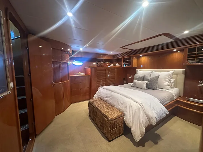 Slide: The Image of Luxurious bedroom interior of 2000 Mikelson 61 Sportfisher yacht with elegant wood finishes. - 39