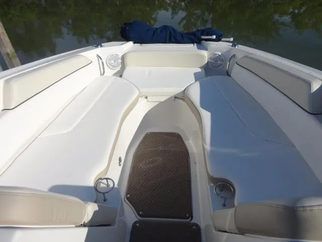 Slide: The Image of 2013 Sea Ray 300 Sundeck boat interior with spacious seating and cup holders. - 29