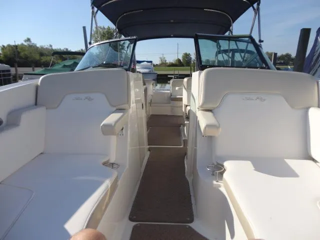 Slide: The Image of 2013 Sea Ray 300 Sundeck interior with spacious seating and canopy. - 30
