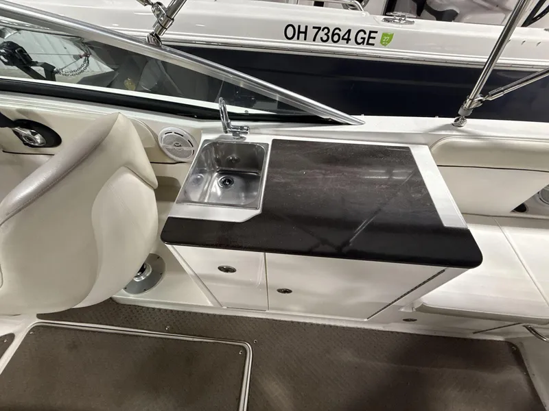 Slide: The Image of 2013 Sea Ray 300 Sundeck interior with sink and countertop, registration OH 7364 GE. - 9