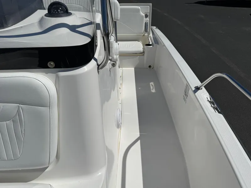 Slide: The Image of 2007 Boston Whaler 200 Dauntless boat interior with white seating and sleek design. - 10