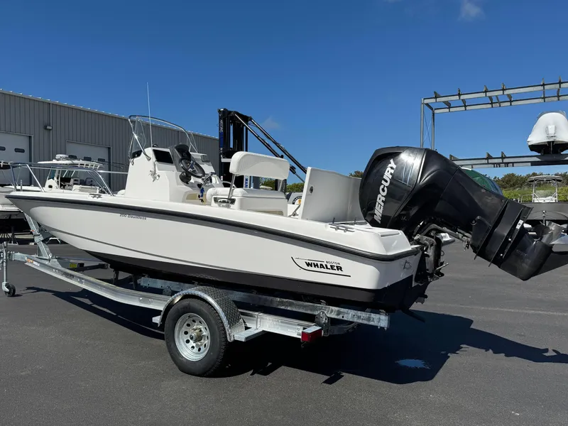 Slide: The Image of 2007 Boston Whaler 200 Dauntless boat on trailer with Mercury outboard motor. - 2