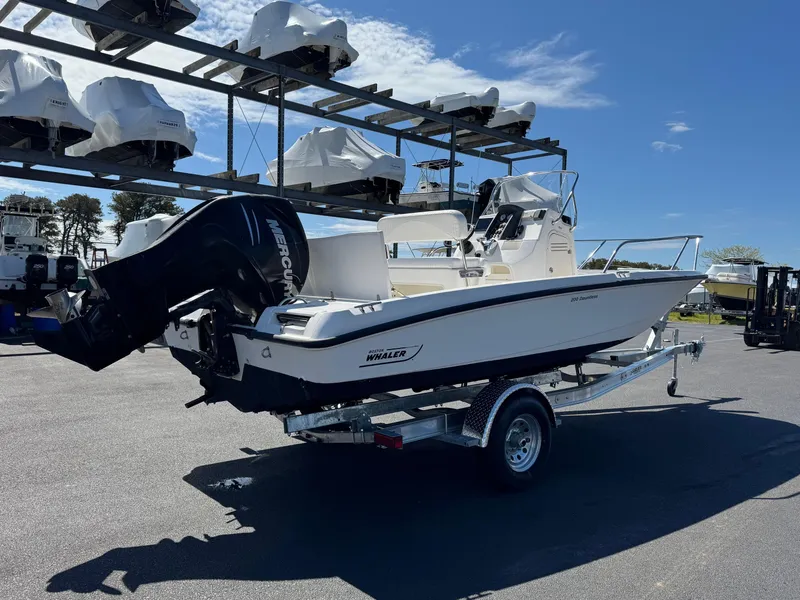 Slide: The Image of 2007 Boston Whaler 200 Dauntless boat on trailer, outdoor storage, sunny day. - 4