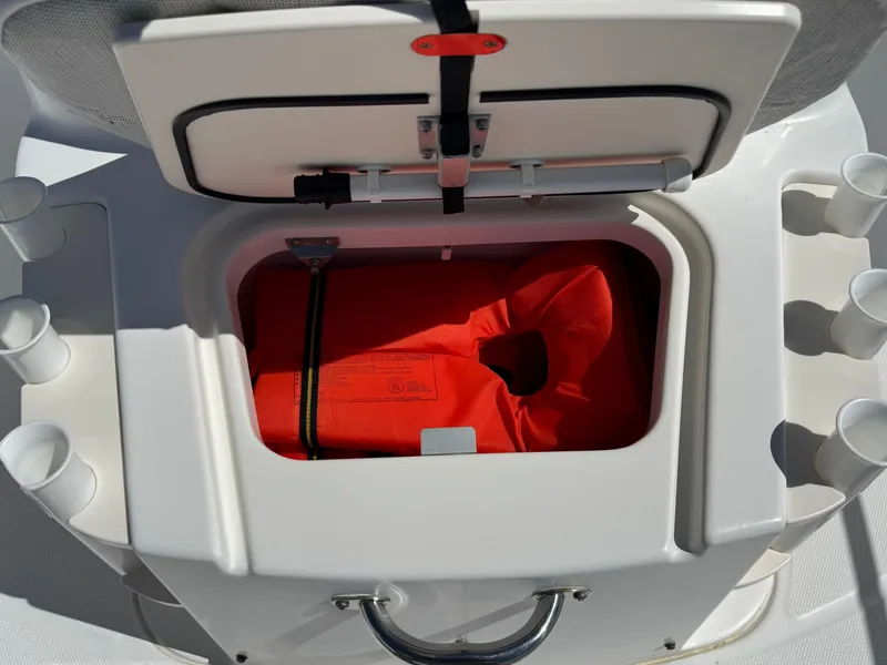 Slide: The Image of Storage compartment with life jacket on a 2007 Boston Whaler 200 Dauntless boat. - 8