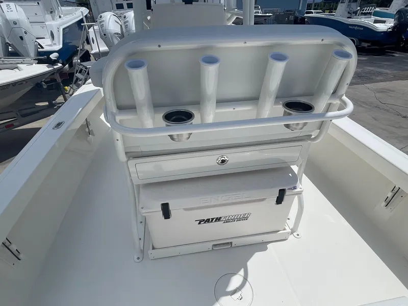 Slide: The Image of 2025 Pathfinder 2200 TRS boat with rod holders and storage compartment. - 8