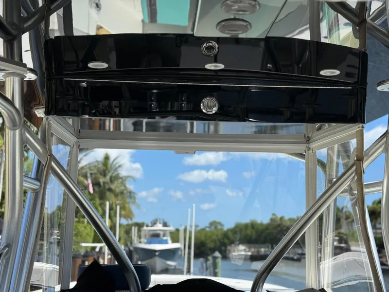 Slide: The Image of 2018 SeaVee 390Z boat interior with view of marina and clear blue sky. - 2