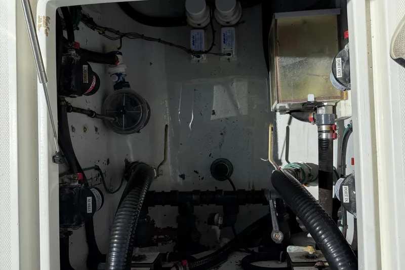 Slide: The Image of Engine compartment of a 2018 SeaVee 390Z boat, showcasing mechanical components and wiring. - 5