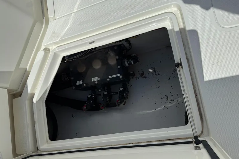 Slide: The Image of Open hatch of 2018 SeaVee 390Z boat showing internal compartment and wiring. - 7