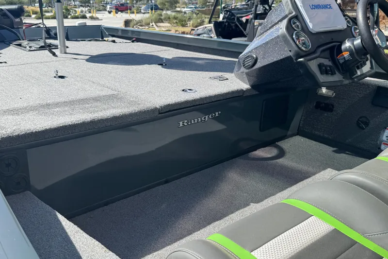 Slide: The Image of 2025 Ranger RT188 boat interior with steering console and seating, featuring Lowrance electronics. - 28