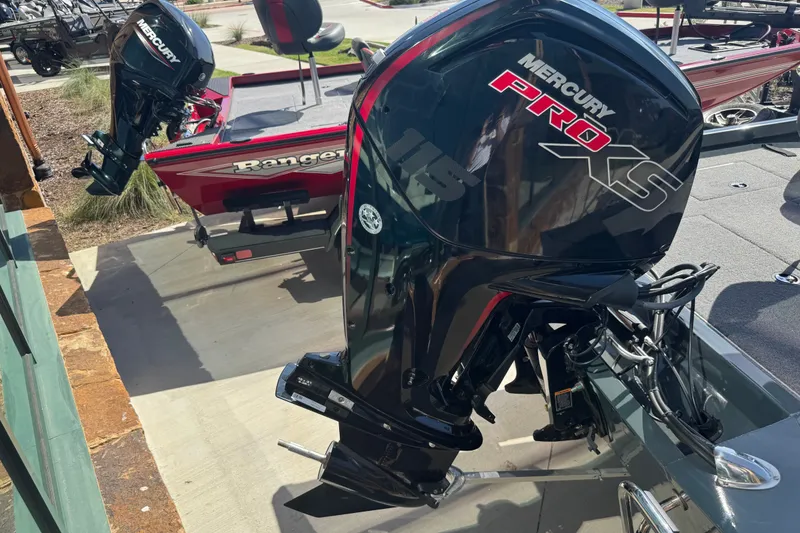 Slide: The Image of 2025 Ranger RT188 boat with Mercury Pro XS outboard motor in a showroom. - 22