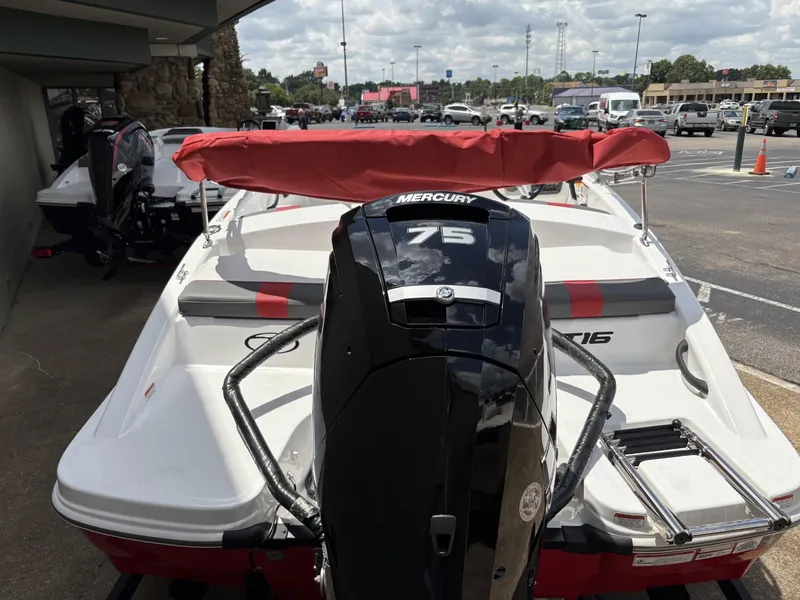 Slide: The Image of 2025 Tahoe T16 boat with Mercury 75 engine, parked outdoors. - 3