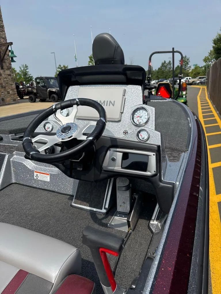 Slide: The Image of 2025 Nitro Z20 XL Pro boat dashboard with steering wheel and gauges. - 2