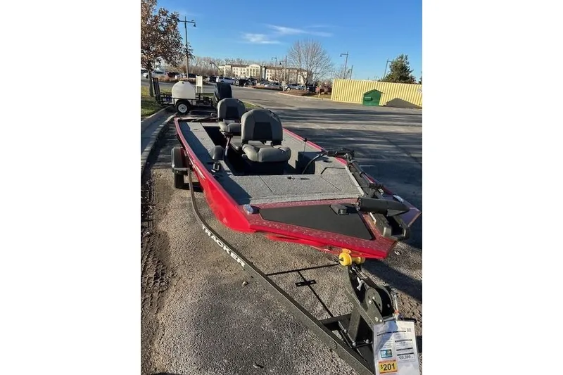 Slide: The Image of 2025 Tracker Panfish 17 boat on trailer, parked outdoors, featuring dual seats. - 38