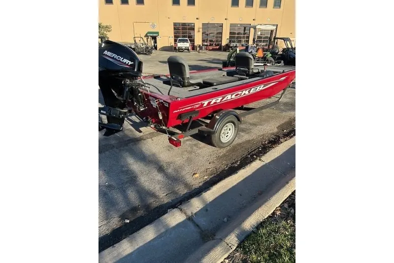 Slide: The Image of 2025 Tracker Panfish 17 boat with Mercury engine, parked on a trailer. - 39