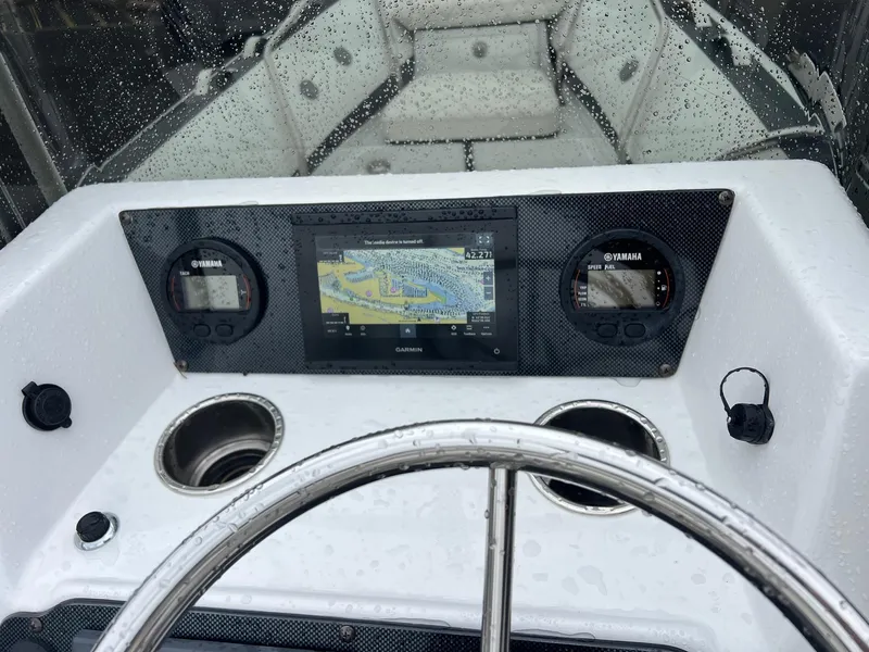 Slide: The Image of 2024 Novurania DL 550 boat dashboard with navigation system and Yamaha gauges. - 19