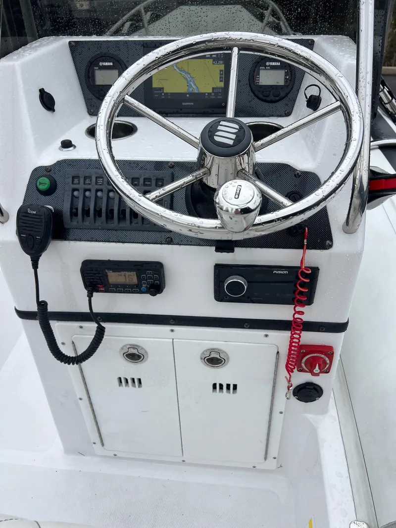 Slide: The Image of 2024 Novurania DL 550 boat console with steering wheel and navigation controls. - 21