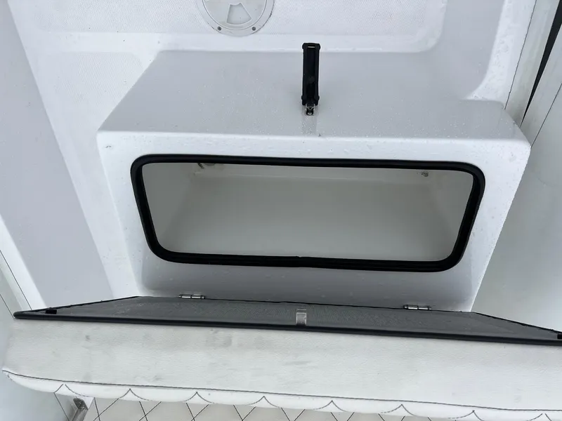 Slide: The Image of 2024 Novurania DL 550 storage compartment with open hatch and handle. - 24