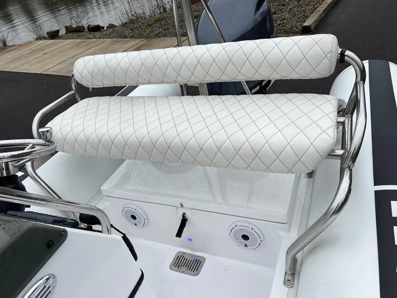 Slide: The Image of 2024 Novurania DL 550 boat with white quilted seating and stainless steel frame. - 25