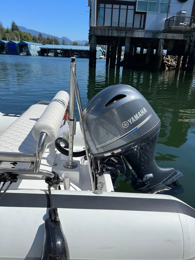 Slide: The Image of 2024 Novurania DL 550 boat with Yamaha outboard motor docked by waterfront. - 33