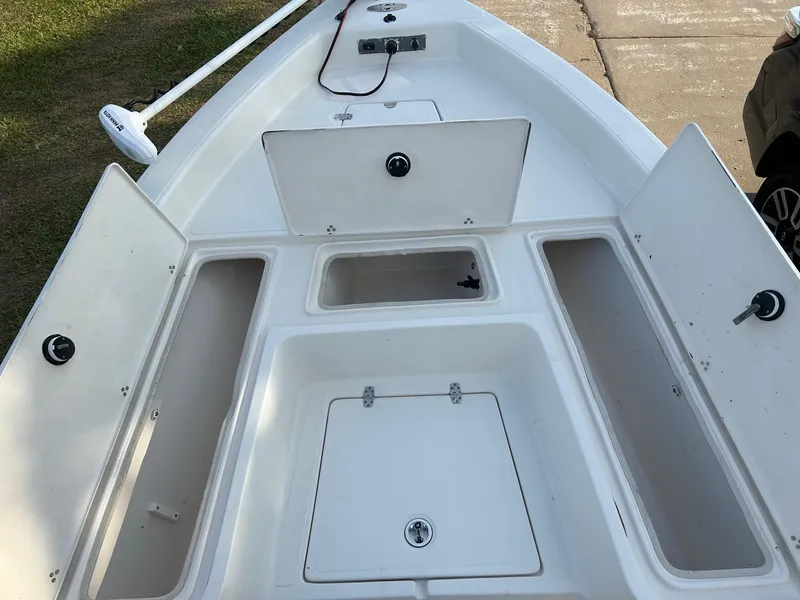 Slide: The Image of 2023 Sea Chaser 23 LX Bay Runner boat deck with open storage compartments. - 4