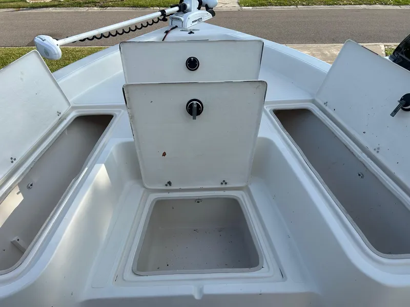 Slide: The Image of 2023 Sea Chaser 23 LX Bay Runner boat storage compartments and deck view. - 6