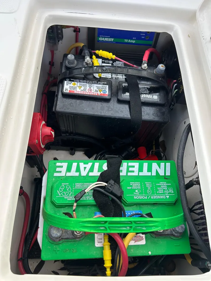 Slide: The Image of Battery compartment of 2023 Sea Chaser 23 LX Bay Runner boat with Interstate battery. - 7