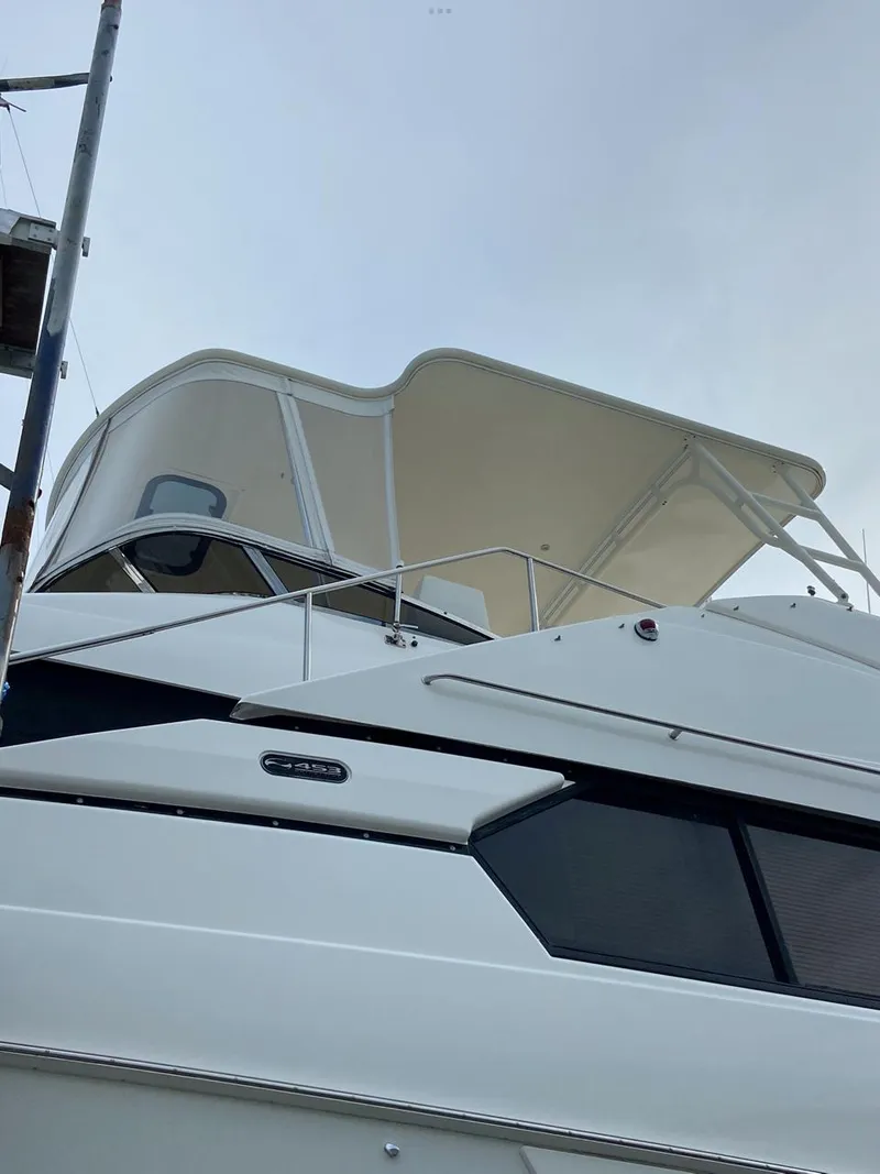 Slide: The Image of 1999 Silverton 453 Motor Yacht with sleek design and spacious upper deck. - 10