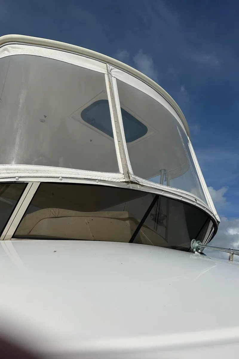 Slide: The Image of 1999 Silverton 453 Motor Yacht bridge against a clear blue sky. - 31