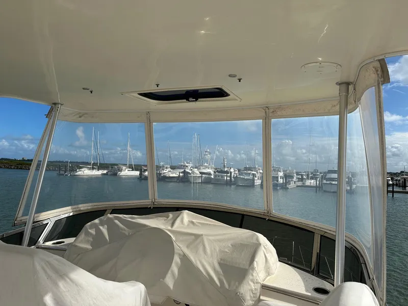 Slide: The Image of 1999 Silverton 453 Motor Yacht interior with marina view through windows. - 32
