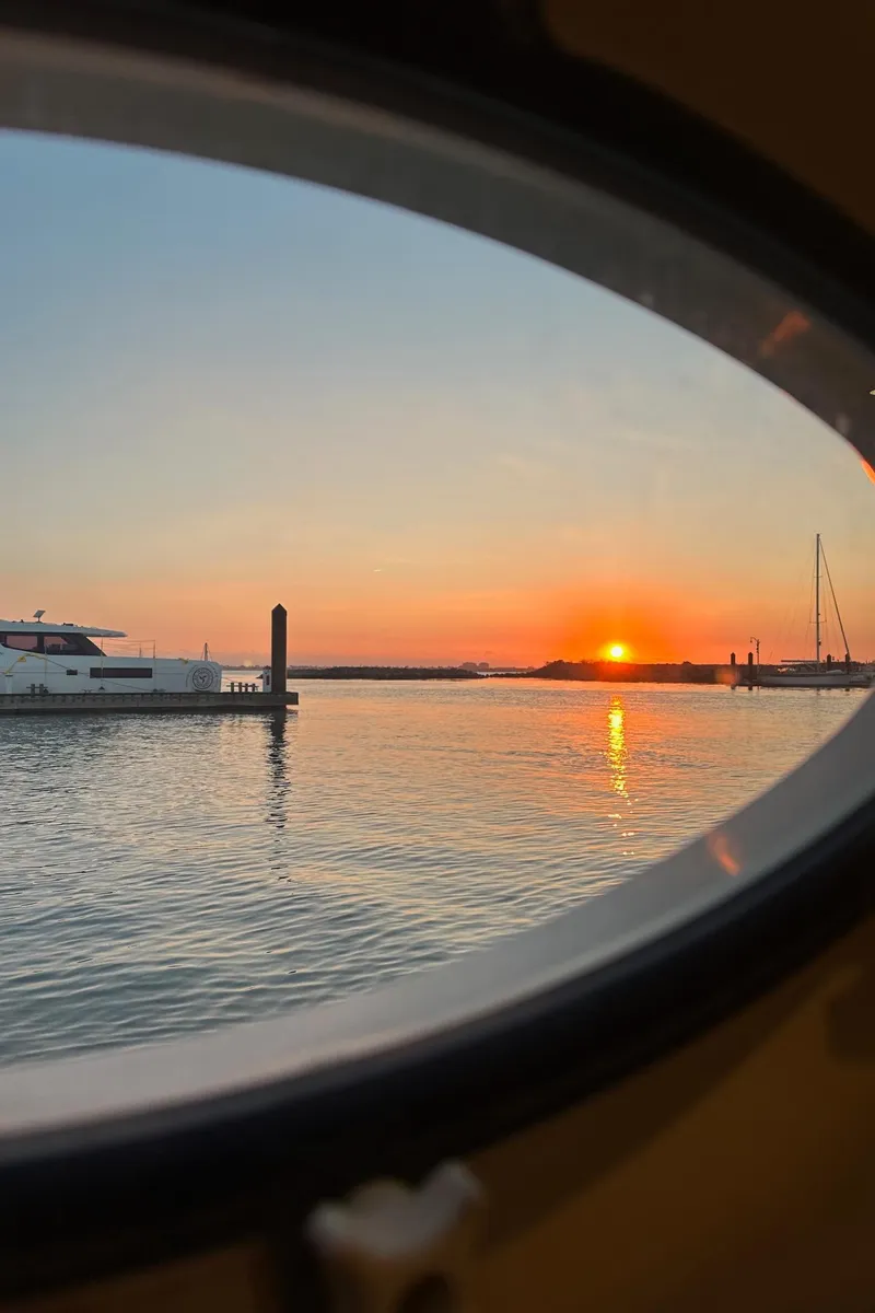 Slide: The Image of View of sunset over water from 1999 Silverton 453 Motor Yacht porthole. - 41