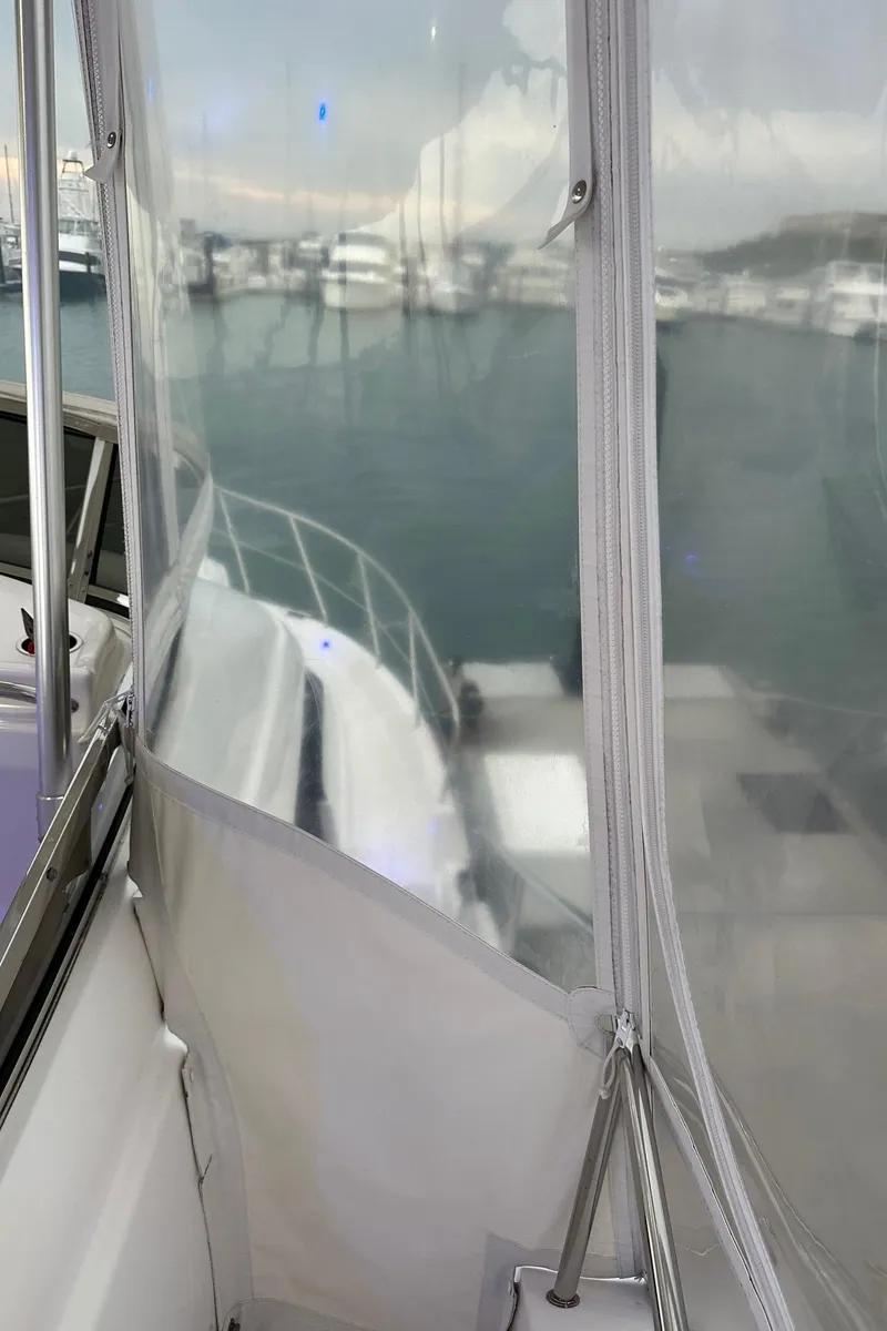 Slide: The Image of 1999 Silverton 453 Motor Yacht docked at marina, view from enclosed deck. - 48