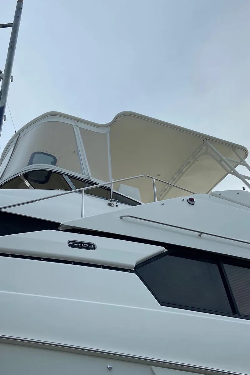 Slide: The Image of 1999 Silverton 453 Motor Yacht with sleek design and spacious upper deck. - 7