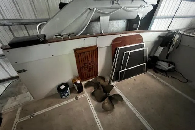 Slide: The Image of 1985 Bayliner 3870 Motoryacht interior with flybridge, propeller, and storage items. - 11