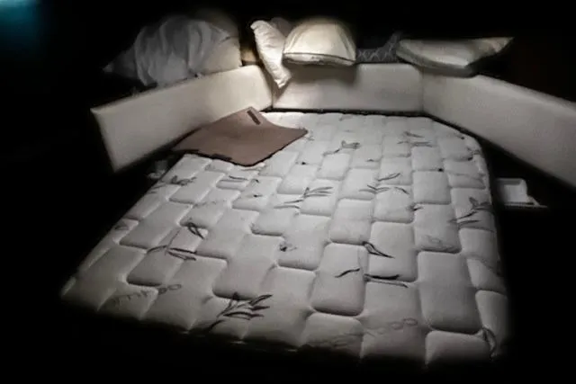 Slide: The Image of Interior cabin of 1985 Bayliner 3870 Motoryacht with bed and pillows. - 16