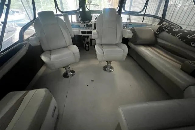 Slide: The Image of 1985 Bayliner 3870 Motoryacht flybridge interior with seating and helm controls. - 30