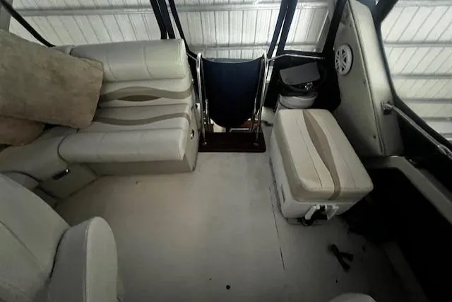 Slide: The Image of 1985 Bayliner 3870 Motoryacht flybridge interior with seating and helm station. - 31