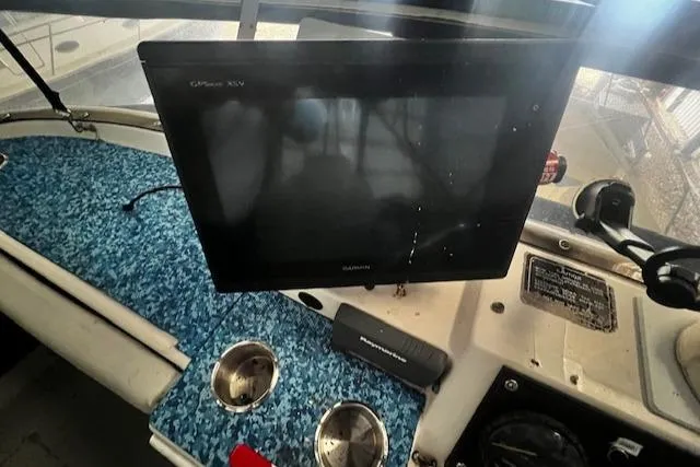 Slide: The Image of 1985 Bayliner 3870 Motoryacht flybridge dashboard with electronics and controls. - 35