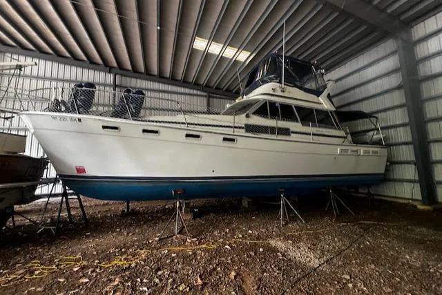 Slide: The Image of 1985 Bayliner 3870 Motoryacht with Flybridge stored in a covered facility. - 37