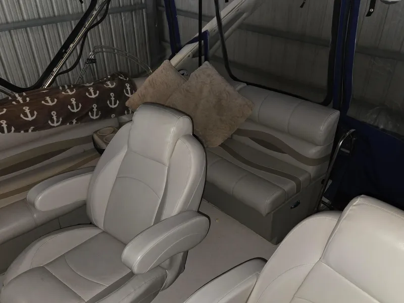 Slide: The Image of Interior of 1985 Bayliner 3870 Motoryacht with Flybridge, featuring plush seating and nautical decor. - 5